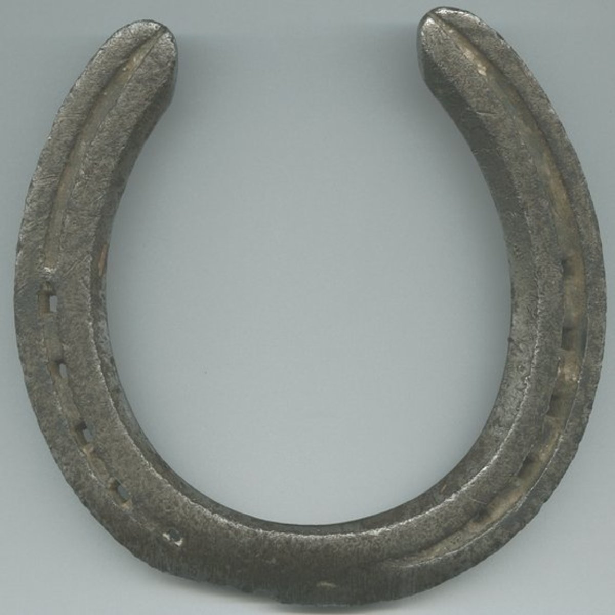 En hestesko med endene pekende opp (som vist her) er lykke til; endene som peker ned er uflaks.